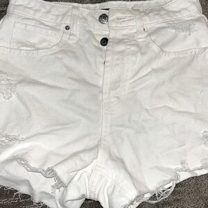 White ripped jean shorts